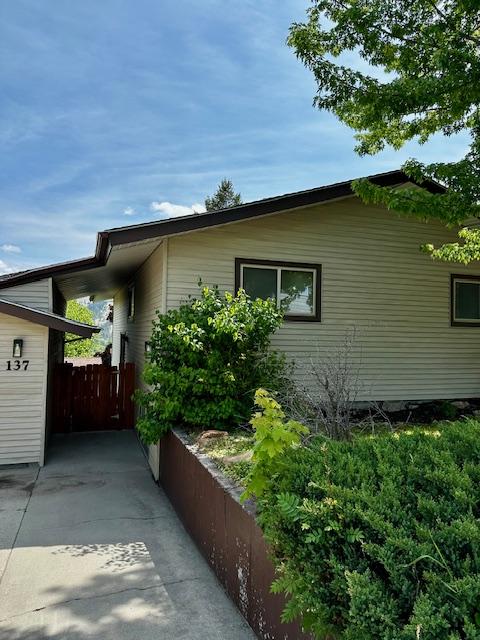 137 Cascade St, Lolo, MT 59847 - view of side of home with fence