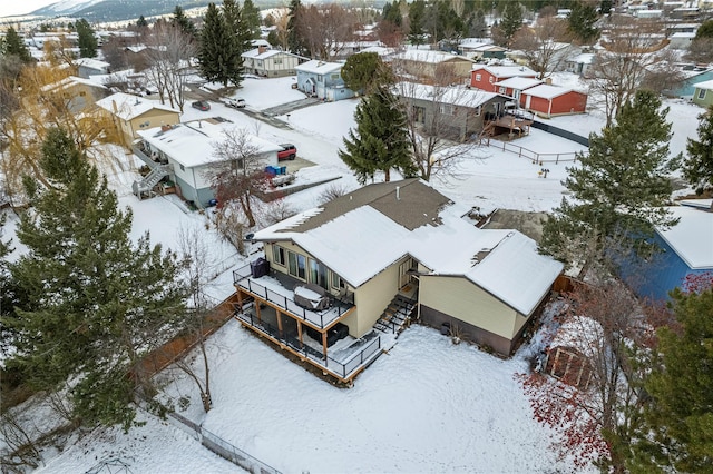 snowy aerial view featuring a residential view