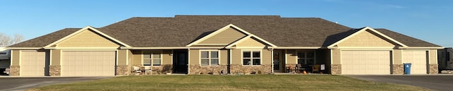 view of front of property with a garage and a front yard