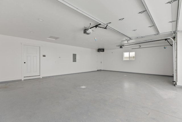 garage featuring a garage door opener and electric panel