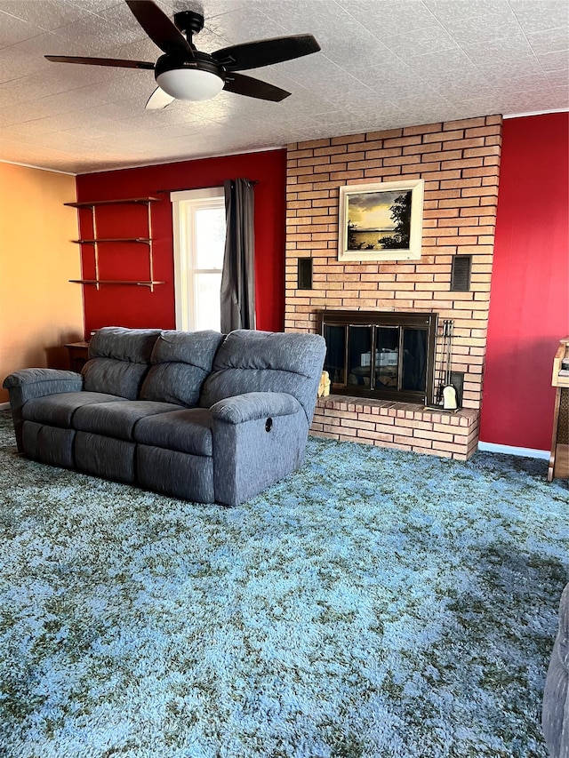 living room featuring a fireplace, ceiling fan, and carpet flooring