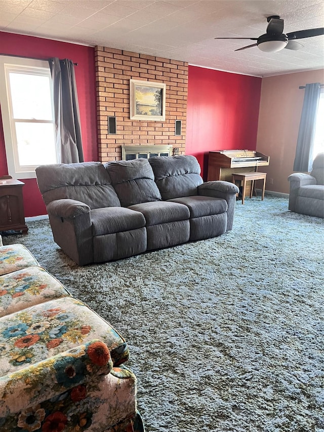 living room featuring ceiling fan and carpet