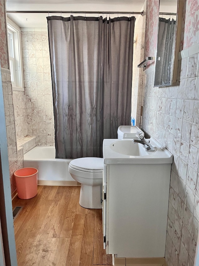 bathroom featuring hardwood / wood-style flooring, vanity, toilet, and a shower with shower curtain