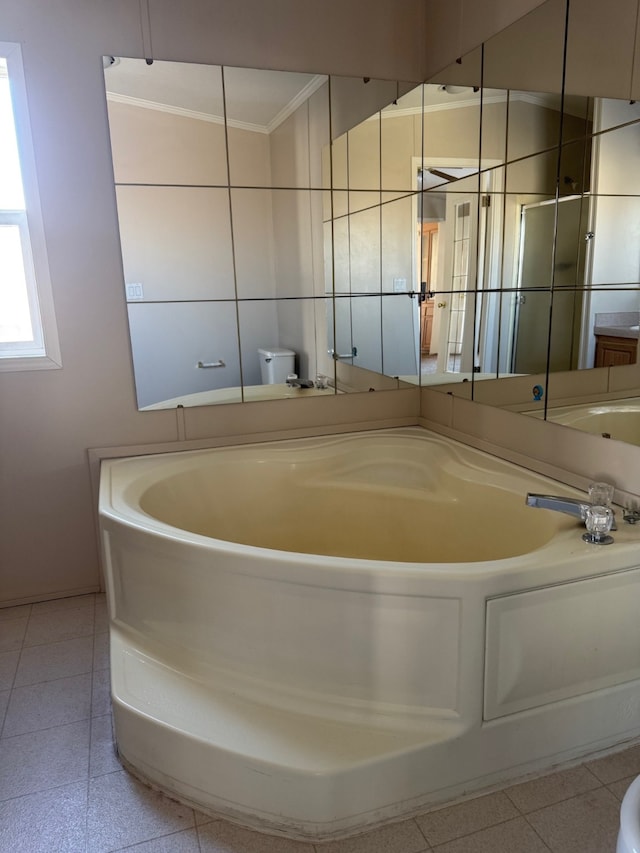 bathroom with ornamental molding and toilet