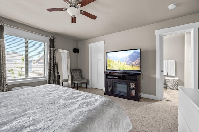 carpeted bedroom with ceiling fan