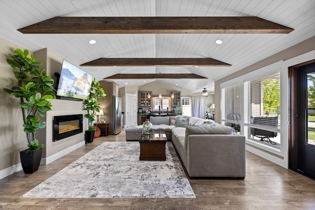 living room with vaulted ceiling with beams, hardwood / wood-style floors, wooden ceiling, and ceiling fan