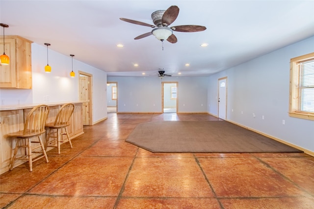 interior space featuring recessed lighting, baseboards, and ceiling fan