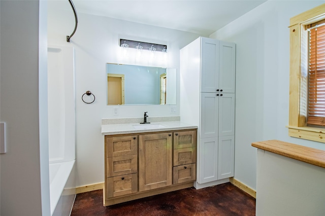 full bath with a shower, baseboards, concrete flooring, and vanity