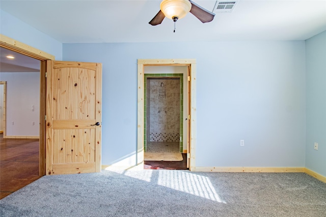 unfurnished bedroom featuring visible vents, carpet flooring, baseboards, and ceiling fan