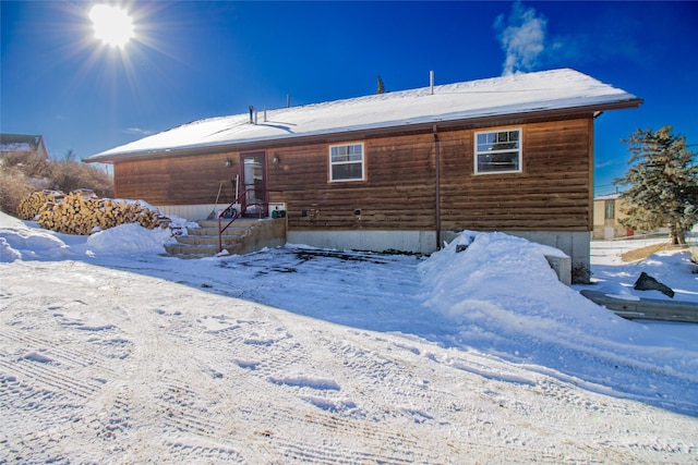 view of snow covered house