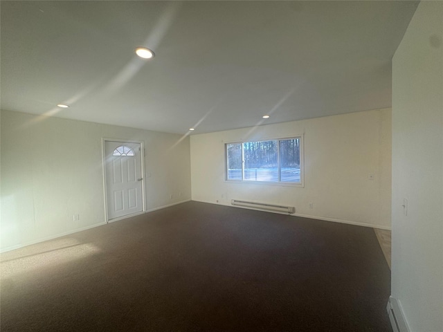 unfurnished room with a baseboard radiator