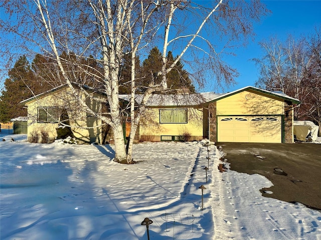 single story home with a garage