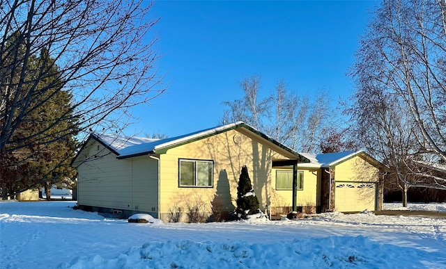 ranch-style home with a garage