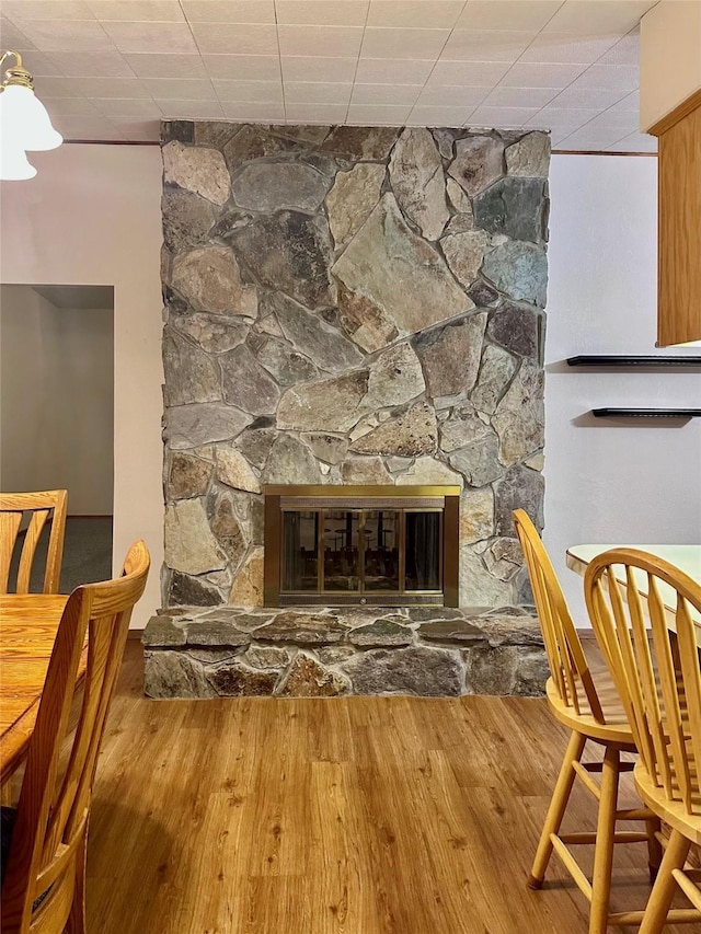 details with a fireplace and wood-type flooring