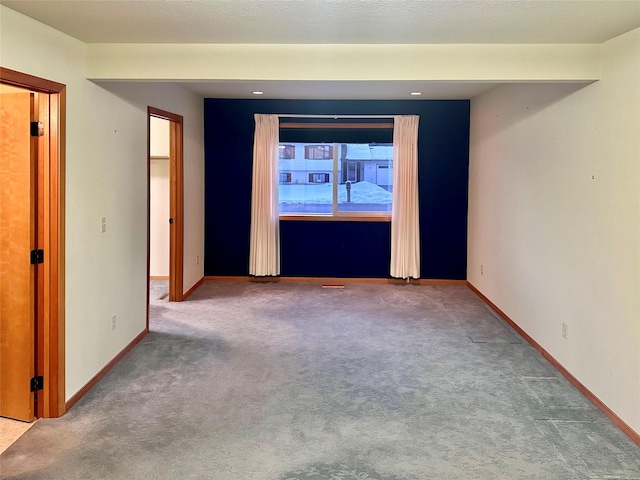 spare room featuring carpet flooring