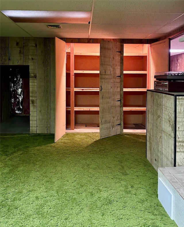 interior space featuring dark colored carpet