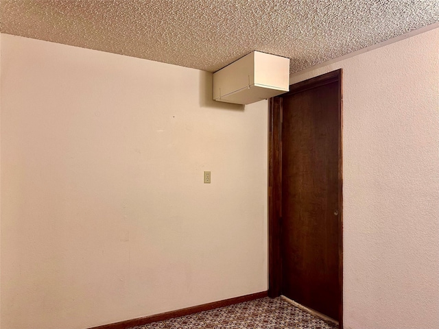 spare room featuring a textured ceiling