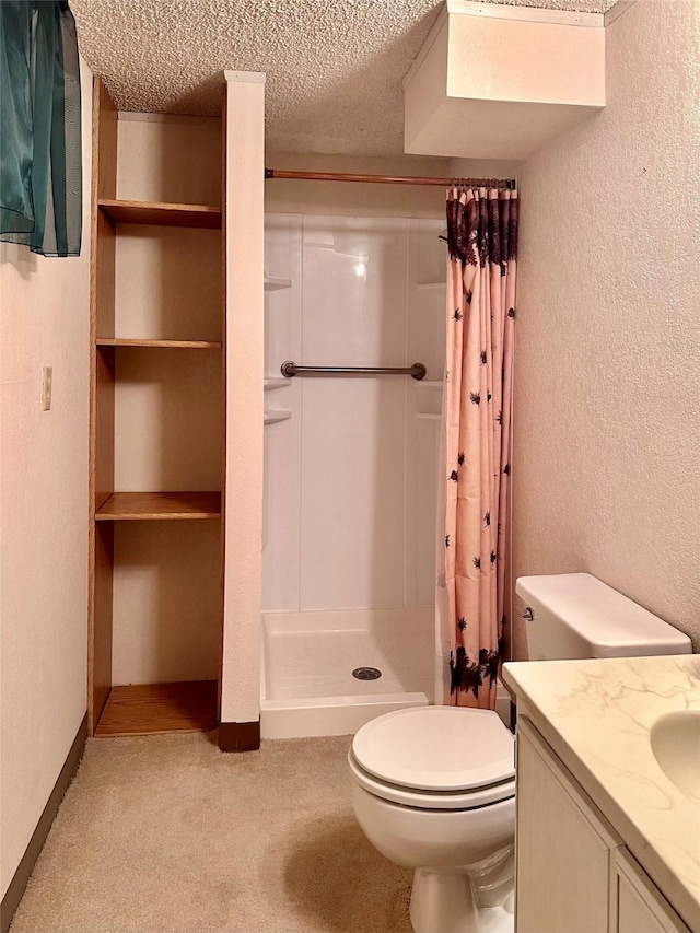 bathroom featuring vanity, toilet, a textured ceiling, and a shower with shower curtain