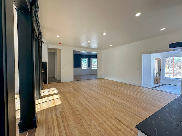 unfurnished living room featuring light hardwood / wood-style flooring