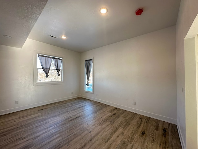 spare room featuring hardwood / wood-style floors