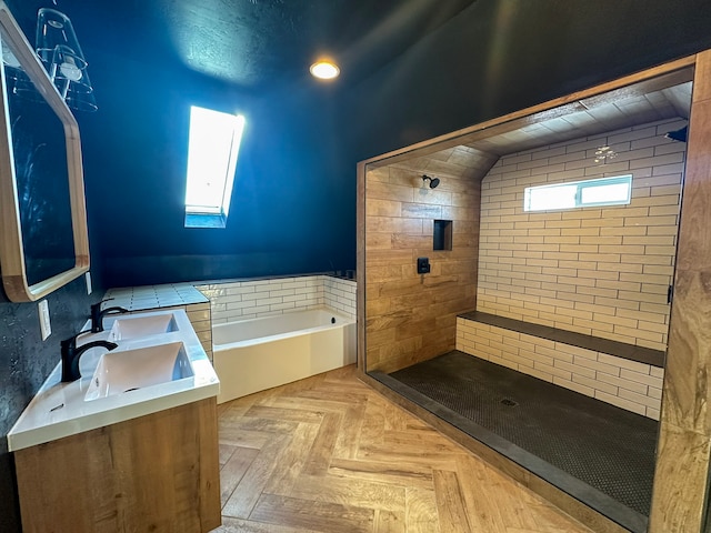 bathroom featuring parquet flooring, vanity, and independent shower and bath