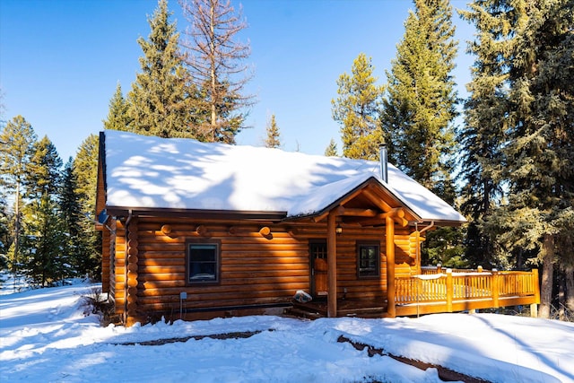 log cabin with a deck