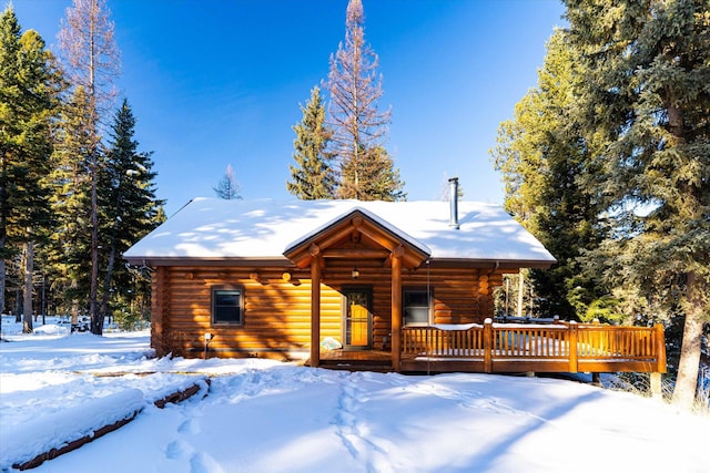 cabin featuring log exterior