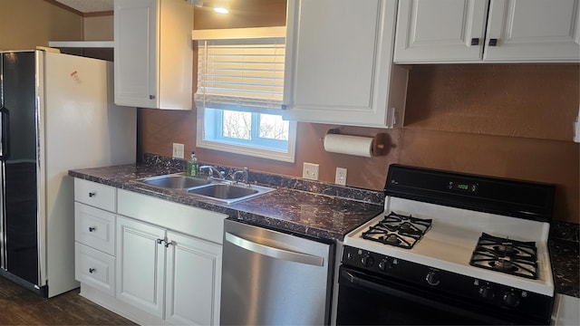 kitchen featuring white cabinetry, sink, stainless steel dishwasher, and gas range oven