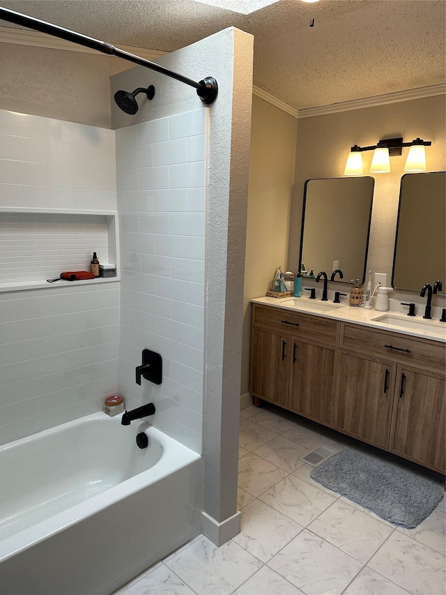 bathroom featuring ornamental molding, vanity, a textured ceiling, and tiled shower / bath