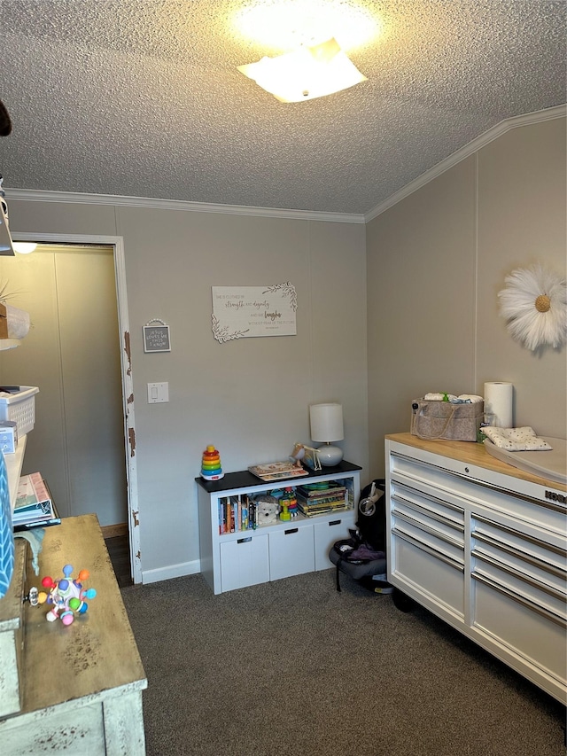 miscellaneous room featuring crown molding, a textured ceiling, and dark carpet