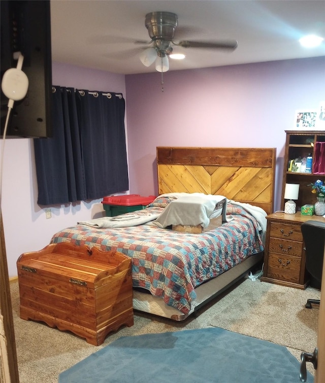 bedroom with ceiling fan and carpet