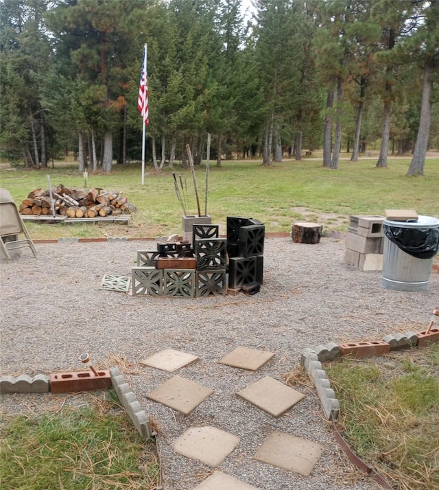 view of yard with a fire pit