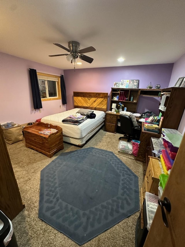 carpeted bedroom featuring ceiling fan