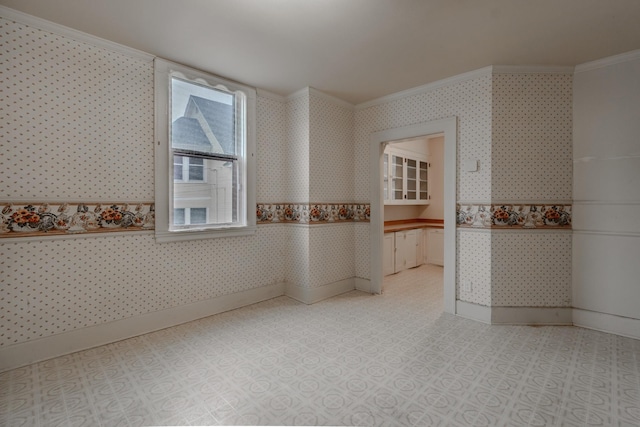 spare room featuring crown molding