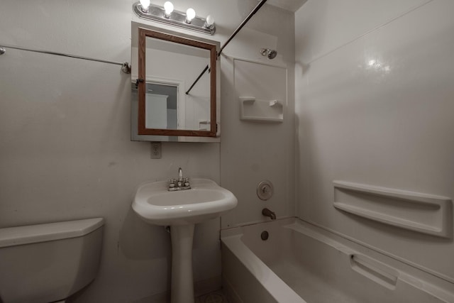 bathroom featuring toilet and shower / bath combination