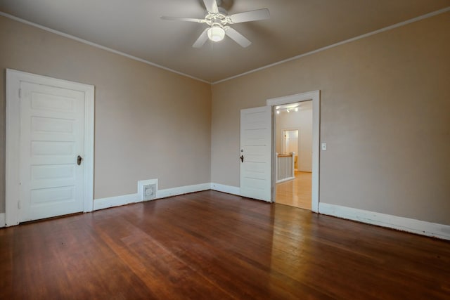 spare room with ornamental molding, dark hardwood / wood-style floors, and ceiling fan