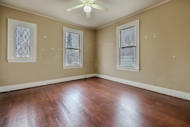 empty room with crown molding, wood-type flooring, and ceiling fan