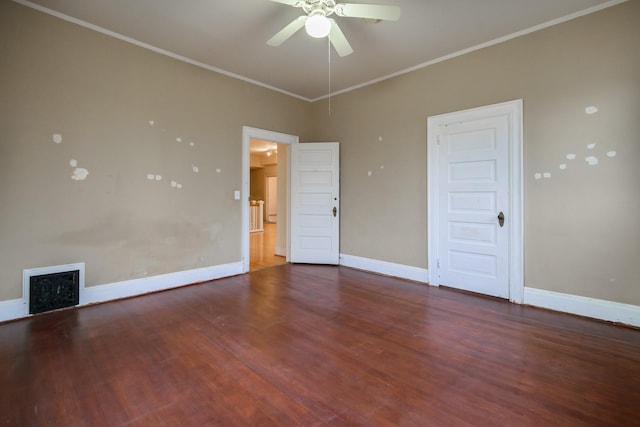 unfurnished room featuring ornamental molding, dark wood-type flooring, and ceiling fan