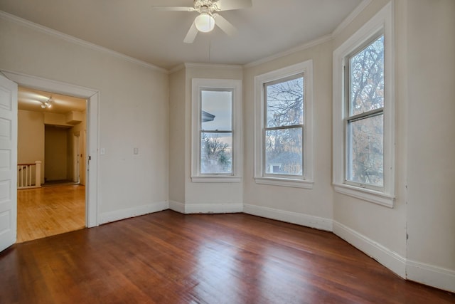 unfurnished room with wood-type flooring, ornamental molding, and ceiling fan