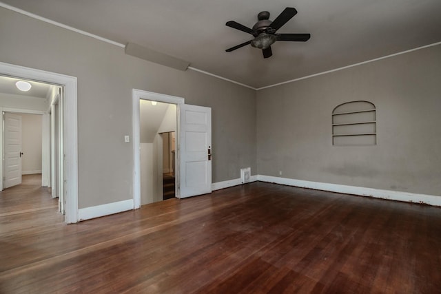 unfurnished bedroom featuring ceiling fan and dark hardwood / wood-style flooring