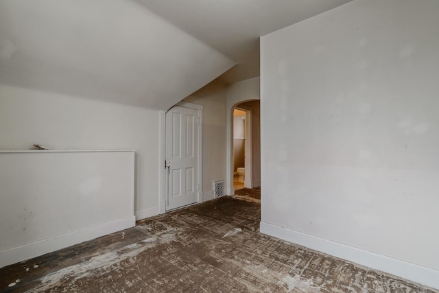 additional living space with vaulted ceiling