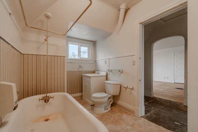 bathroom featuring vanity, toilet, and a bathtub