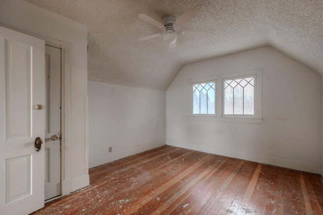 bonus room with vaulted ceiling, wood-type flooring, ceiling fan, and a textured ceiling