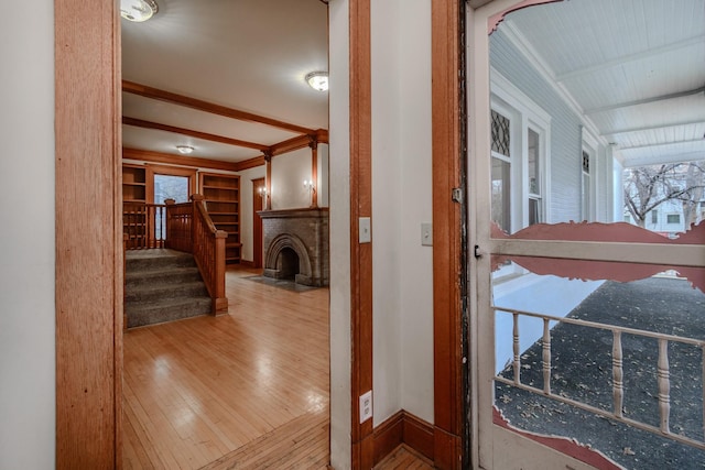 hall featuring hardwood / wood-style flooring and built in features