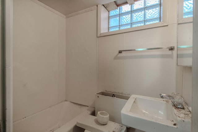 bathroom with sink and a bathing tub