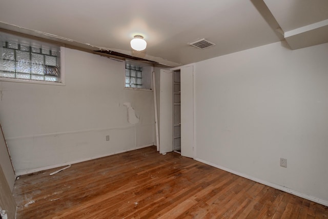 unfurnished bedroom with wood-type flooring