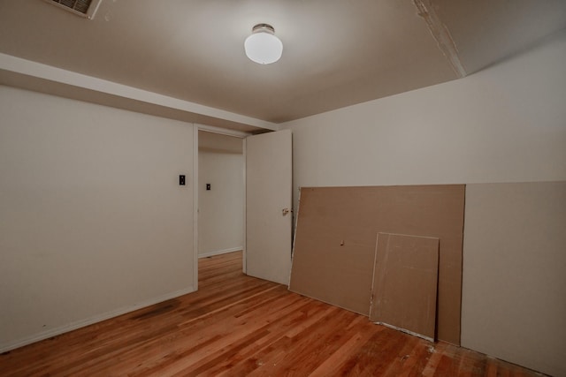 bonus room with light hardwood / wood-style flooring