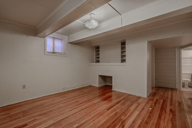 interior space featuring ornamental molding and light wood-type flooring