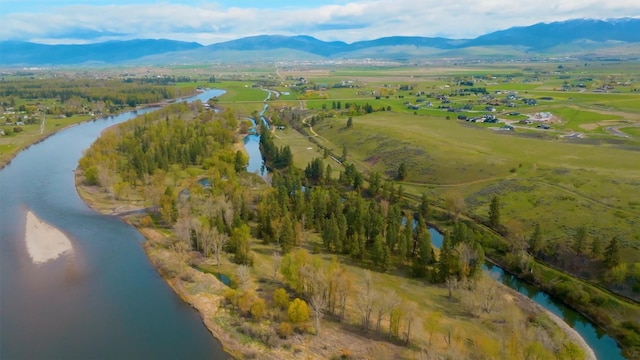 aerial view featuring a rural view and a water and mountain view