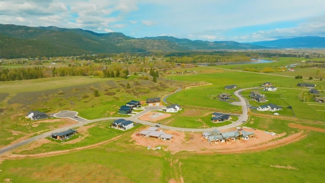 aerial view with a mountain view and a rural view